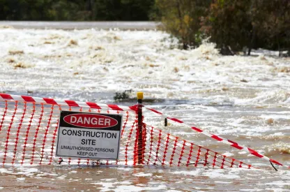 Warning sign in the middle of flooded area